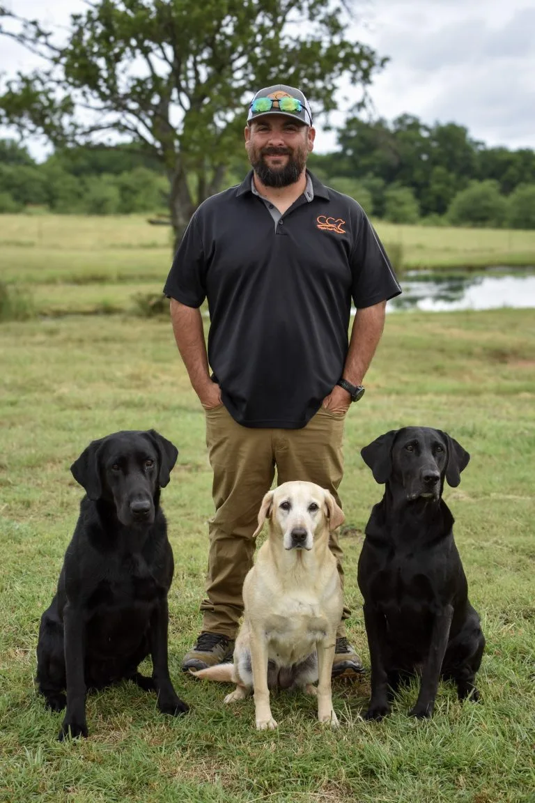 Cripple Creek Retrievers strives to achieve our client’s goals, whether that is a hunting companion or a Master National Qualifier.  Our staff enjoys assisting clients from puppy selection to teaching clients how to handle their newly trained retriever.  We take pride in providing the same care to client’s dogs as we would our own; a happy, healthy dog that loves to learn during the training process and bonds with our trainers and the dog owner to achieve their goals.

JC Strange-Owner and Head Trainer
JC has 20 years of experience training and handling retrievers professionaly. JC has excelled at every venue offered to retrievers.  JC’s main focus at Cripple Creek Retrievers is Advanced Training and Competition dogs while also overseeing all aspects of training from obedience to finished field work.

Abi Strange-Owner and Head Administrator
Abi is responsible for business side of the operation.  She handles the billing and scheduling for Cripple Creek Retrievers.  Abi is also in charge of the Whelping Service where she handles puppy whelping and finding the perfect home for each puppy.
 
 

Garrett Davis- Foundation & Competetive Trainer
Garrett joined CCR in 2025 and brings 5 years of dog training experience with him. As our foundation trainer he focuses on building the skills, confidence, and consistency that dogs need before moving into more advance work. He also works with both gun dogs and competiton dogs, helping develop everything from dependable hunting partners to dogs preparing to step to the line at hunt tests.
Cripple Creek Retrievers Proudly Uses and Endorses the Following Products: