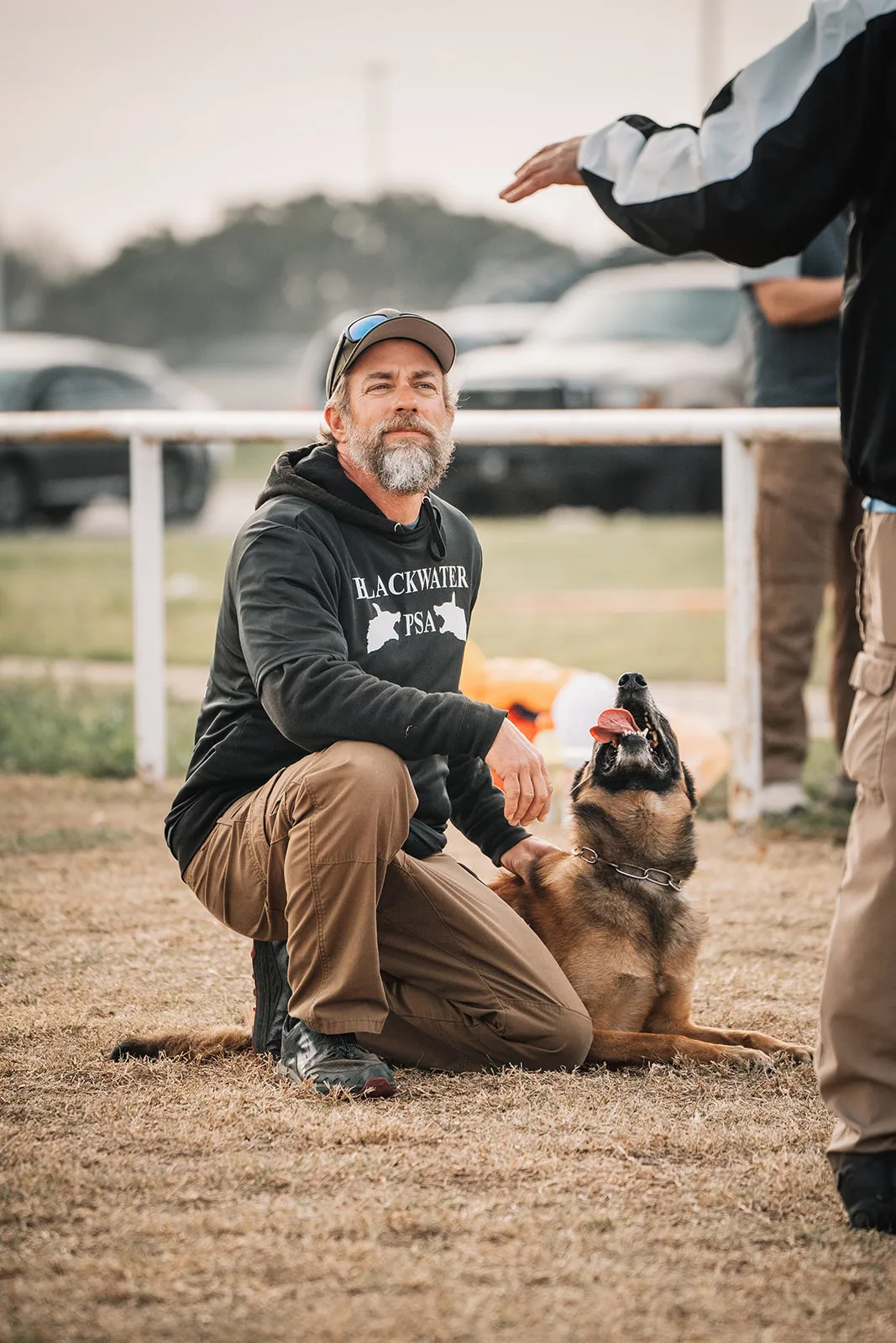 Professional dog trainer Matt working with German Shepherd during training session