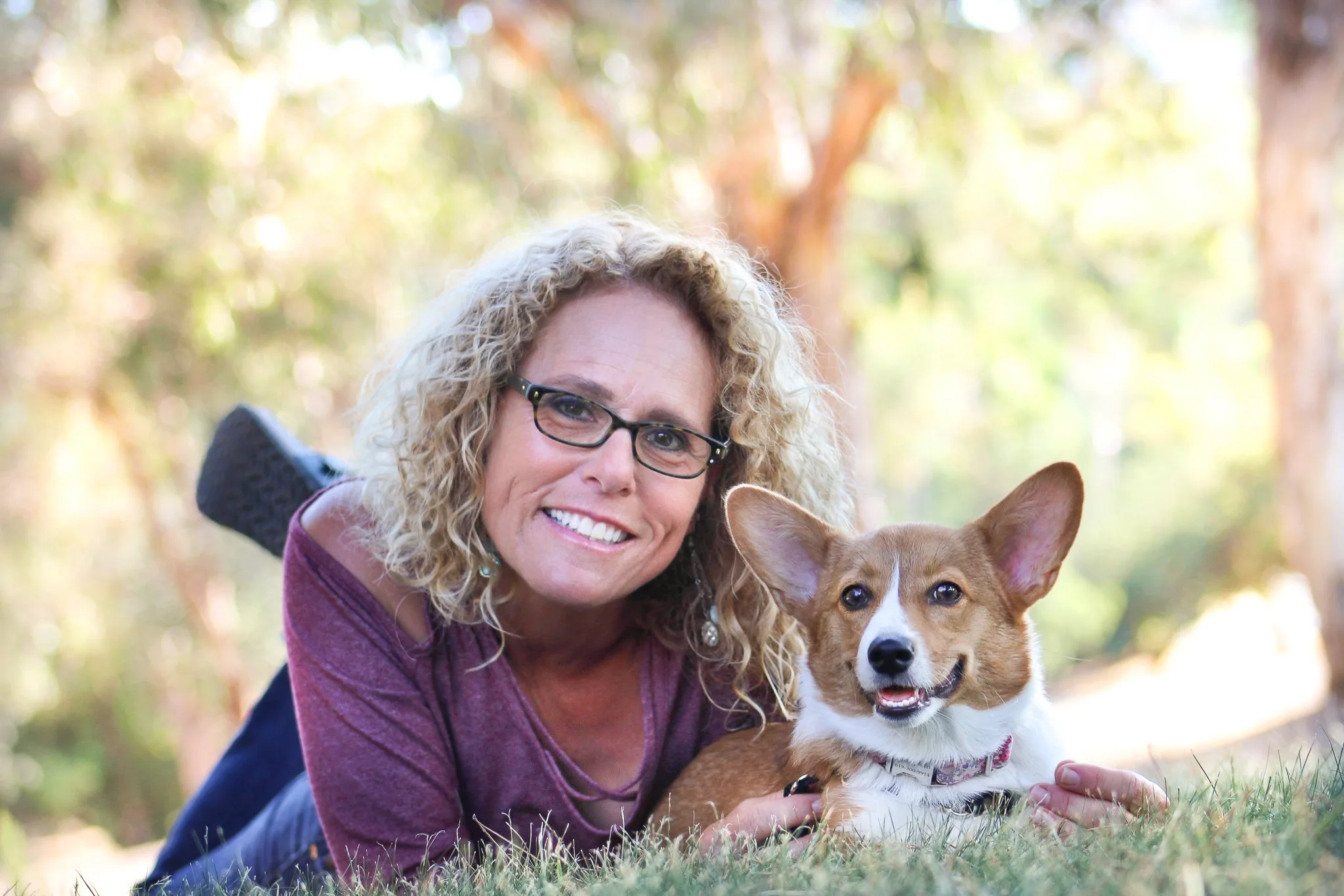 AboutJulie Schmitt2026-05-20T16:29:47-07:00Julie Schmitt trains dogs the same way she raises her kids.  As a mom of two girls, she knows that raising kids is not a “fix it and forget it” prospect, and the same is true when working with dogs.  She believes that when dogs act out, it’s too easy to lose sight of their moments of greatness, so she helps empower frustrated dog owners to create lasting change in their dogs, leading to improved behavior and more shared joy. The methods she employs represent a lifestyle choice.  They are the same practices that can be used to improve relationships with family members, friends, or co-workers.Vision: Keep it simple, appreciate the small things, find the joy.Julie has been a professional dog trainer for over 30 years.  She is the only dog trainer in San Diego who is a licensed Guide Dog Mobility Instructor (GDMI), Certified Professional Dog Trainer – Knowledge Assessed (CPDT-KA), Certified Victoria Stilwell Positively Dog Trainer (VSPDT), and a Certified Fear Free Professional.Who recommends her and where she can be foundShe is recommended by the El Cajon Animal Shelter, Coastview Veterinary Hospital, Cuyamaca Animal Hospital, El Cerrito Veterinarian Hospital, Judy Veterinary Clinic, Lake Murray Village Veterinary Clinic, Mast Blvd. Pet Hospital, Mission Valley Pet Clinic, Rancho San Carlos Vet Clinic, Santee Pet Hospital, Spring Valley Animal Medical Hospital, VCA Grossmont, numerous professional animal trainers and other pet professionals.  She can often be found working with clients at Fiesta Island, hiking trails at Cowles Mountain, or walking at Lake Murray.  Julie conducts many training sessions at parks throughout the East County, with specific emphasis on such neighborhoods as Del Cerro, Rolando, San Carlos, Santee, El Cajon, Lemon Grove, La Mesa, and Lakeside.CredentialsLicensed Guide Dog Mobility InstructorCertified Professional Dog Trainer- Knowledge AssessedCertified Victoria Stilwell Positive Dog TrainerCertified Fear Free ProfessionalLicensed Be a Tree Presenter (dog bite prevention for children)Member, The International Association of Animal Behavior ConsultantsProfessional Member, Association of Professional Dog TrainersHer storyIn 1996, Julie began working at the prestigious and world renowned  In 2002, Julie and her family moved to San Diego where she established Out N’ About Dog Training.  She was privileged to be approved as a Victoria Stilwell Positively Dog Trainer by Victoria Stilwell herself, star of Animal Planet’s hit TV series  and a passionate advocate for positive reinforcement training methods.Julie lives in La Mesa with her husband, who is a veterinarian. They have three terrific dogs and a cool salt water fish tank. Their two daughters also pop in and out of the house, as they practice “adulting.” Julie has a passion for her work and a love for animals that is evident in her training style. “I have a  2 year old Shiba Inu named Corner who has the name for a reason… Julie was an amazing dog trainer and a very professional person! I have never gone to a trainer or had one come to the house before because I was afraid of how they would treat Corner since he is like a kid to me. I found Julie online and chose her specifically because of her training philosophy. I didn’t want Corner to be punished during training and Julie’s training program is based upon rewards.  I am very impressed with this experience. Corner has had three sessions so far and has had remarkable improvements! He is a very smart/stubborn little guy and Julie knew just how to handle his antics. I highly recommend her to anyone! Its well worth it!” – Rachel